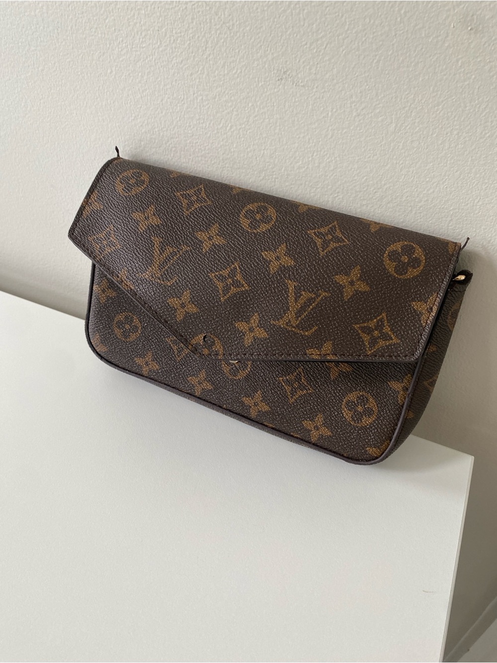 Louis Vuitton Monogram Flap Clutch in Brown Faux